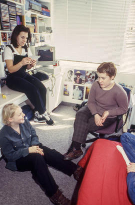 Photograph of students gathered together and chatting in a residence dorm