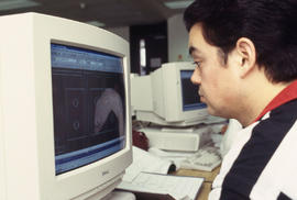 A photograph of a student at a computer in the Technology lab
