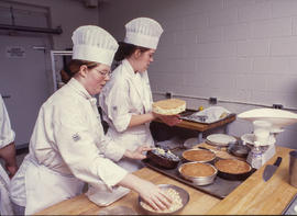 Photograph of culinary students working together