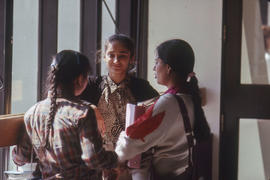 Photograph of students in the entrance hallway near the main E building stairwell