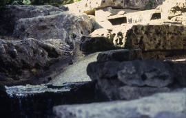 Photograph of a waterfall flowing between rocks