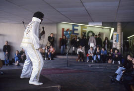 Photograph of an Elvis Impersonator Performing in the Concourse