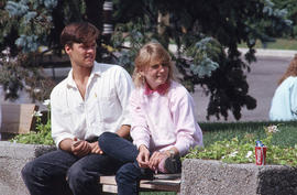 Photograph of two students on a bench
