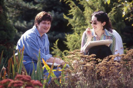 Photograph of students working at sketching in the Arboretum