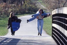 Photograph of friends playing around in the Arboretum
