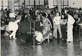 Photograph of Students Participating in a Limbo Contest During Winter Madness
