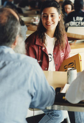 Photograph of John Steckley with students in the Lakeshore cafeteria