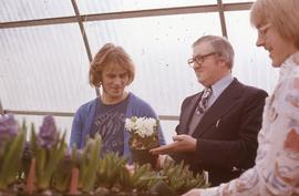 Students with faculty member Russ Geddes (center) in the plant nursery : [photograph]