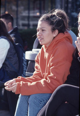 Photograph of students seated on a bench