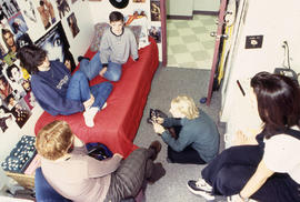 Photograph of students gathered in a residence dorm