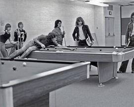 Photograph of students playing billiards