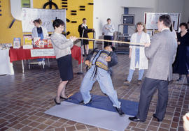 Photograph of a limbo dance contest in the E Building