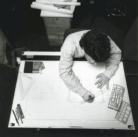 Photograph of an Architecture Student Using a Drafitng Table