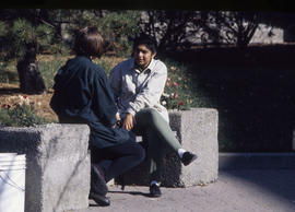 Photograph of students having a chat on a patio outside the Humber Room