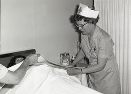 Photograph of attending to a patient