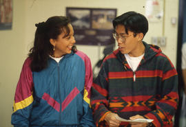 Photograph of Two Students Talking in Class