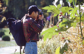 Photograph of a Photography student in the Arboretum