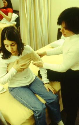 Photograph of nursing student working with a student patient