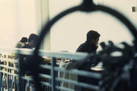 Photograph of an artistic representation of students studying in the library