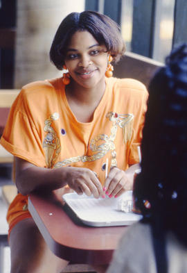 Photograph of Someone Sitting in the Kites Cafeteria