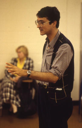Photograph of a student talking to a group