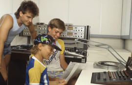 Photograph of students at a radio broadcasting studio