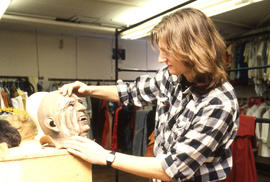 Photograph of a Theatre student working on a character mask