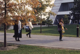Photograph of students on campus walkway