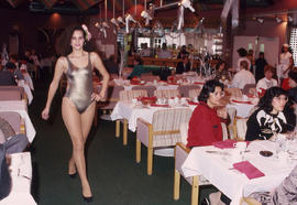 Photograph of a fashion model in a dining room