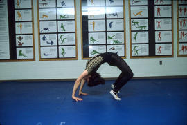 Photograph of Someone Stretching in the Athletic Centre Gym