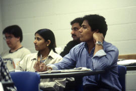 Photograph of students sitting in class listening to an unknown lecture