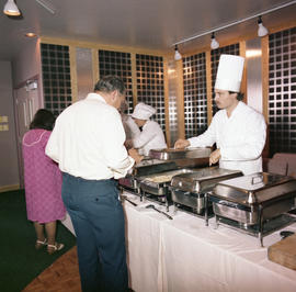 Photograph of a staff member and guest