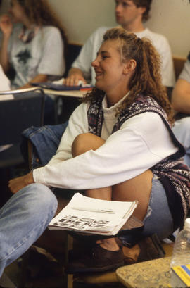 Photograph of a Student Sitting in Class