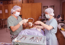 Photograph of medical students practising operating room procedures