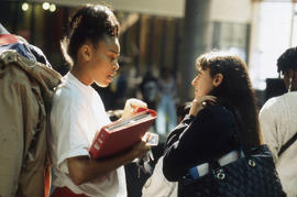 Photograph of Two Students Talking in the Hall