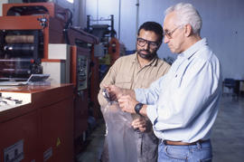 Photograph of an instructor engaged in production quality check