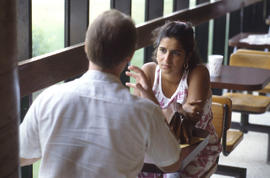 Photograph of two persons in conversation