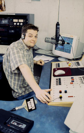 Photograph  of student in Humber radio broadcasting studio