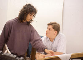 Photograph of two students working together at a drafting table