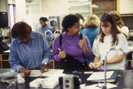A photograph of students working together in the Chemistry lab