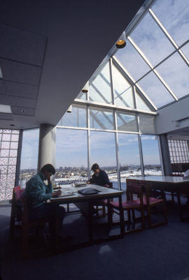 Photograph of students working on the top floor in the library