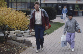 Photograph of people on a walkway at North