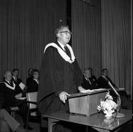Photograph of the chairman of the Board of Govenors addressing the graduating class