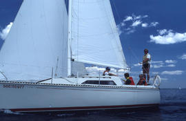 Photograph of students learning sailing skills on a boat