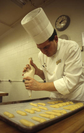 Photograph of a culinary student at work
