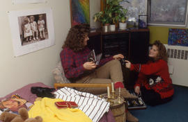 Photograph of two students in an Osler residence room