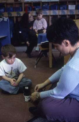 Photograph of early childhood educators interacting with children