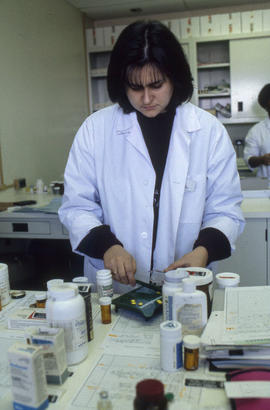 Photograph of a Pharmacy counting pills