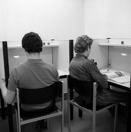 Photograph of students using the study careels in the library