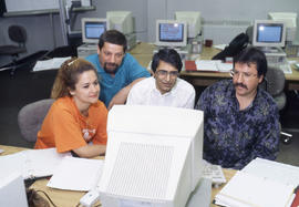 Photograph of students collaborating on an assignment in the computer lab